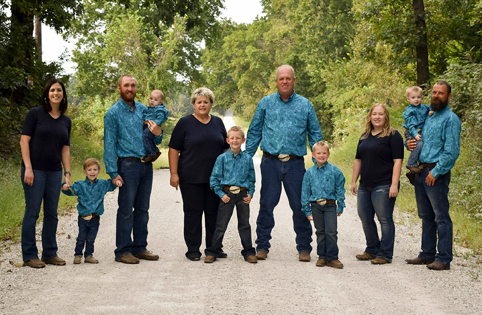 Hinkle family posing on gravel road